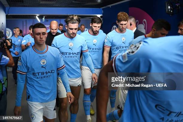 Phil Foden, Jack Grealish, Ruben Dias and John Stones of Manchester City look on in the tunnel before the second half during the UEFA Champions...