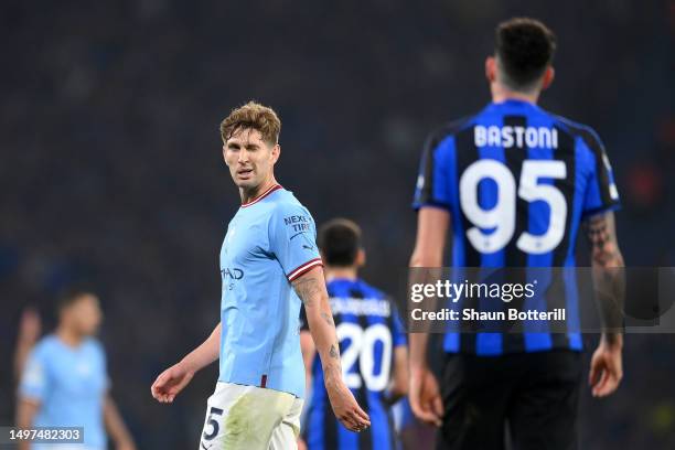 John Stones of Manchester City interacts with Alessandro Bastoni of FC Internazionale during the UEFA Champions League 2022/23 final match between FC...