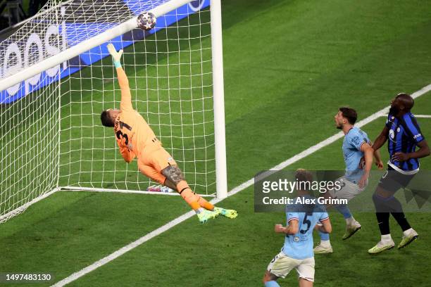Federico Dimarco of FC Internazionale hits the crossbar with a header as Ederson of Manchester City dives during the UEFA Champions League 2022/23...