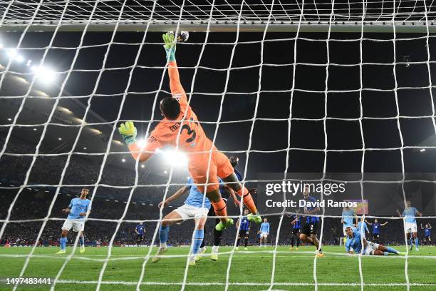 Federico Dimarco of FC Internazionale hits the crossbar with a header as Ederson of Manchester City dives during the UEFA Champions League 2022/23...