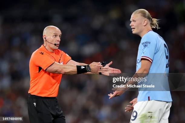 Referee Szymon Marciniak gestures towards Erling Haaland of Manchester City during the UEFA Champions League 2022/23 final match between FC...
