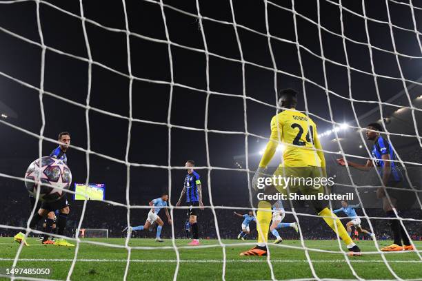 Rodri of Manchester City celebrates after scoring the team's first goal past Andre Onana of FC Internazionale during the UEFA Champions League...