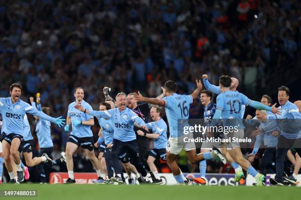 Manchester City players and staff celebrate after the team's victory in the UEFA Champions League 2022/23 final match between FC Internazionale and...