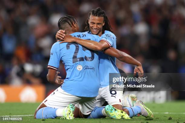 Nathan Ake of Manchester City celebrates with teammate Manuel Akanji after the team's victory in the UEFA Champions League 2022/23 final match...