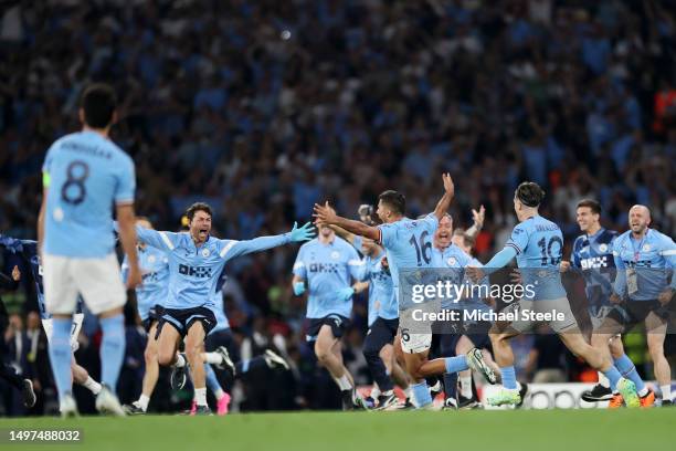 Manchester City players and staff celebrate after the team's victory in the UEFA Champions League 2022/23 final match between FC Internazionale and...