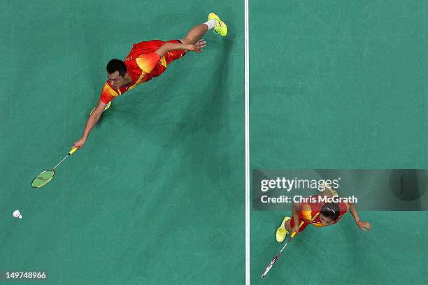 Chen Xu and Jin Ma of China compete in the Mixed Doubles Badminton Gold Medal match against compatriots Nan Zhang and Yunlei Zhao of China on Day 7...