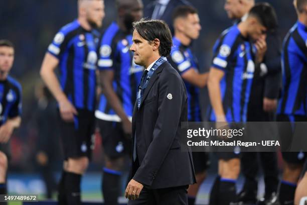 Simone Inzaghi, Head Coach of FC Internazionale, looks dejected with their runners up medal after the team's defeat during the UEFA Champions League...