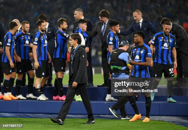 Simone Inzaghi, Head Coach of FC Internazionale, looks dejected while wearing their runners up medal after the team's defeat in the UEFA Champions...