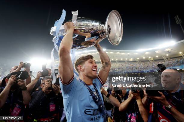 John Stones of Manchester City celebrates with the UEFA Champions League trophy after the team's victory during the UEFA Champions League 2022/23...