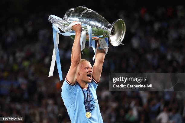 Erling Haaland of Manchester City celebrates with the UEFA Champions League trophy after the team's victory during the UEFA Champions League 2022/23...