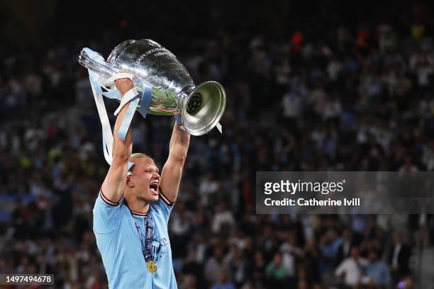 Erling Haaland of Manchester City celebrates with the UEFA Champions League trophy after the team's victory during the UEFA Champions League 2022/23...