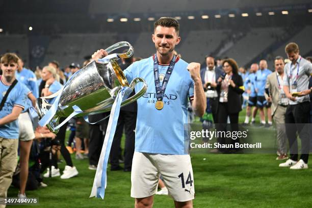 Aymeric Laporte of Manchester City celebrates with the UEFA Champions League trophy after the team's victory in the UEFA Champions League 2022/23...