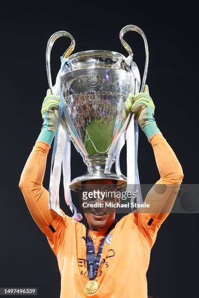 Ederson of Manchester City celebrates with the UEFA Champions League trophy after the team's victory in the UEFA Champions League 2022/23 final match...