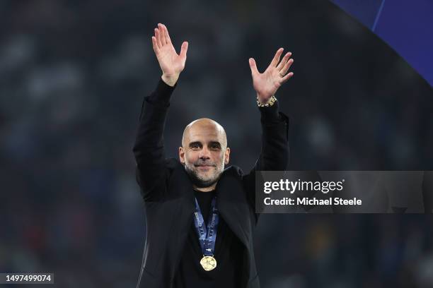 Pep Guardiola, Manager of Manchester City, celebrates while wearing his winners medal after the team's victory in the UEFA Champions League 2022/23...