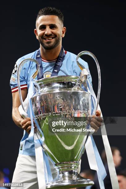 Riyad Mahrez of Manchester City celebrates with the UEFA Champions League trophy after the team's victory during the UEFA Champions League 2022/23...