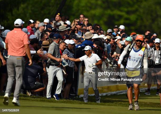 Pan of Chinese Taipei greets fans on the 15th hole during the third round of the RBC Canadian Open at Oakdale Golf & Country Club on June 10, 2023 in...