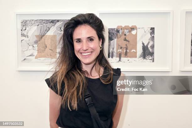 Visual artist/photographer Helene Bellanger poses with her work of images printed on used packaging during Helene Bellanger’s “Bianco Ordinario”...