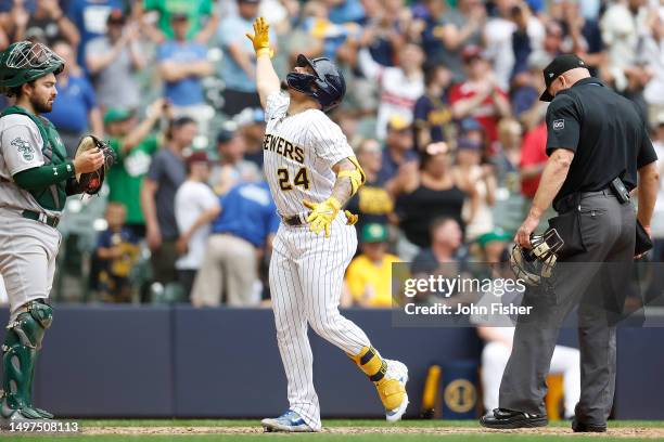 William Contreras of the Milwaukee Brewers crosses home plate after hitting a solo home run in the eighth inning against the Oakland Athletics at...