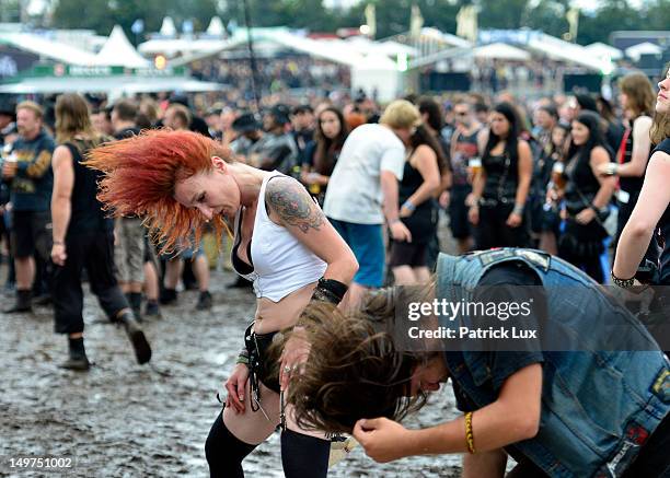 Music fans headbang at the Wacken Open Air heavy metal music fest on August 3, 2012 in Wacken, Germany. Approximately 75,000 heavy metal fans from...