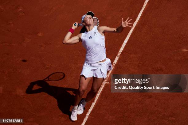Iga Swiatek of Poland serves against Karolina Muchova of Czech Republic during the Women's Singles Final match on Day Fourteen of the 2023 French...
