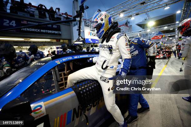 Jimmie Johnson, driver of the NASCAR Next Gen Chevrolet ZL1 changes drivers with Jenson Button during the 100th anniversary of the 24 Hours of Le...