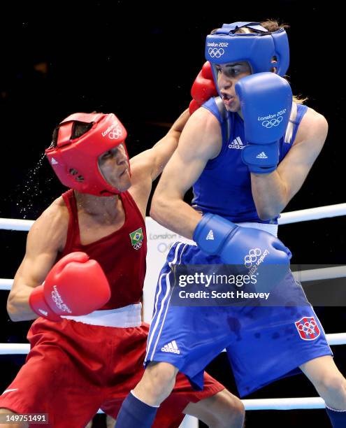 Jeyvier Cintron Ocasio of Puerto Rico in action with Juliao Henriques Neto of Brazil during the Men's Fly Boxing on Day 7 of the London 2012 Olympic...