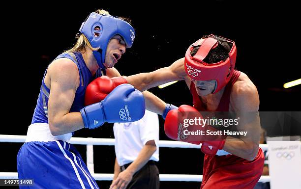 Jeyvier Cintron Ocasio of Puerto Rico in action with Juliao Henriques Neto of Brazil during the Men's Fly Boxing on Day 7 of the London 2012 Olympic...
