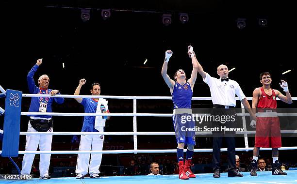 Jeyvier Cintron Ocasio of Puerto Rico celebrates his victory over Juliao Henriques Neto of Brazil during the Men's Fly Boxing on Day 7 of the London...