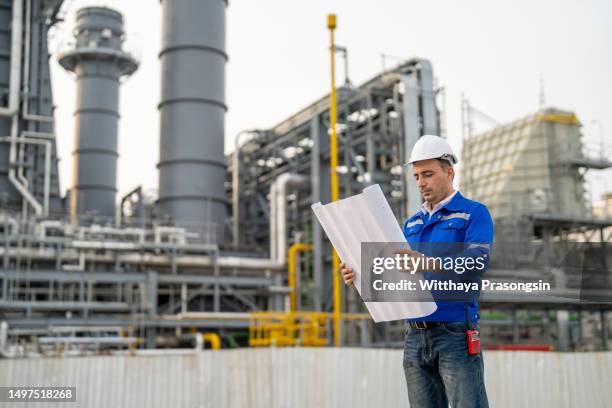 service engineer is working at gas turbine electric power plant - gas turbine electrical power plant stock pictures, royalty-free photos & images