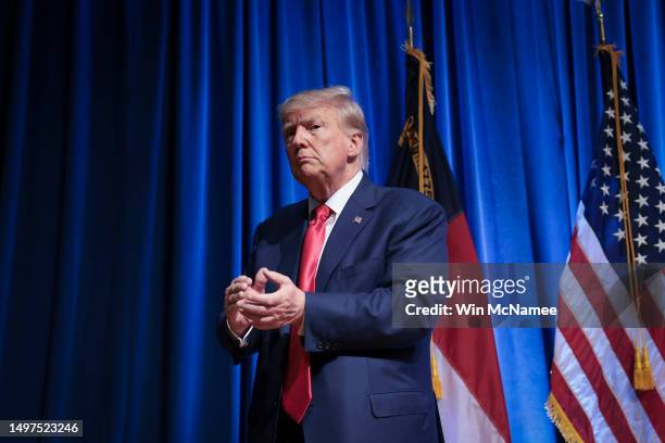 Republican presidential candidate former U.S. President Donald Trump leaves the stage after delivering remarks June 10, 2023 in Greensboro, North...