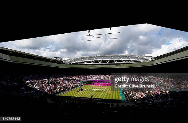 General view of Wimbledon is seen as Roger Federer of Switzerland returns a shot against Juan Martin Del Potro of Argentina in the Semifinal of Men's...