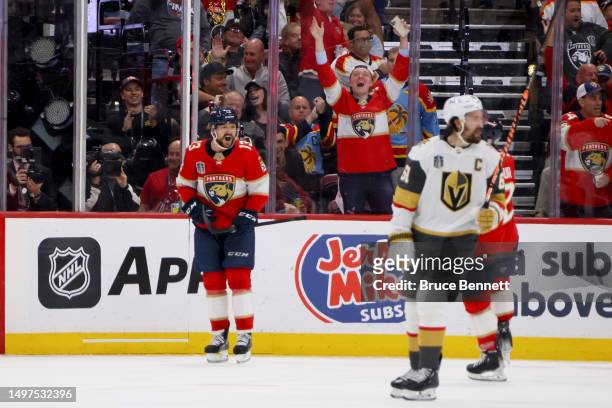 Sam Reinhart of the Florida Panthers congratulates Brandon Montour after he scores a goal against the Vegas Golden Knights during the second period...