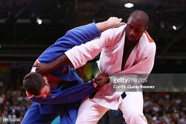 Teddy Riner of France and Alexander Mikhaylin of Russia compete in the Men's +100 kg Judo on Day 7 of the London 2012 Olympic Games at ExCeL on...