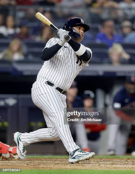 Willie Calhoun of the New York Yankees follows through on his sixth inning home run against the Boston Red Sox at Yankee Stadium on June 10, 2023 in...