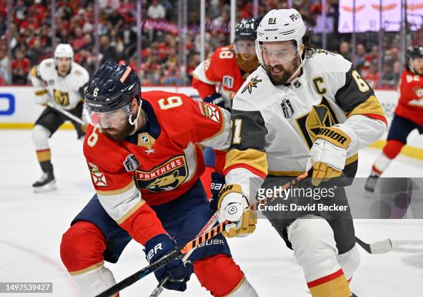Mark Stone of the Vegas Golden Knights battles Colin White of the Florida Panthers during the third period in Game Four of the 2023 NHL Stanley Cup...