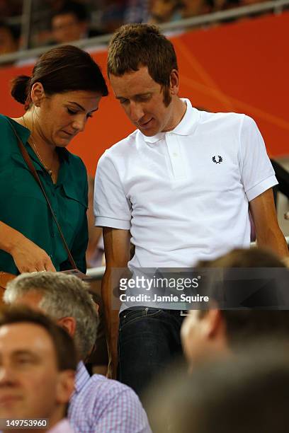 London 2012 Olympic gold medalist and 2012 Tour de France winner Bradley Wiggins of Great Britain and his wife Catherine Wiggins take their seats to...