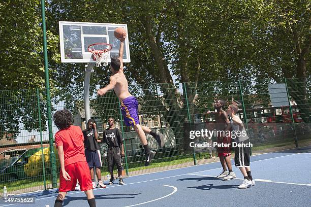 Youths play basketball on courts at Ducketts Common, resurfaced after the riots that struck across the borough. Efforts are being made to rejuvinate...