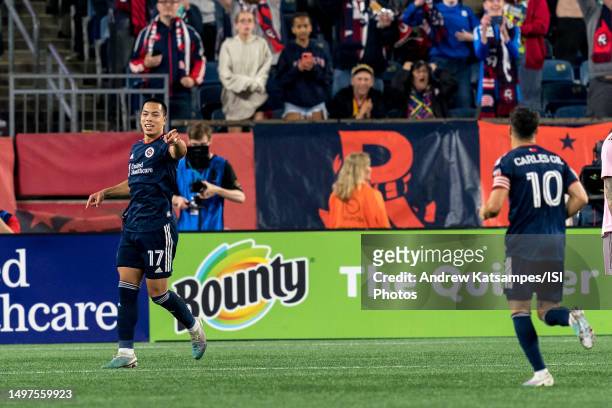 Bobby Wood of New England Revolution credits an assist after scoring during a game between Inter Miami CF and New England Revolution at Gillette...