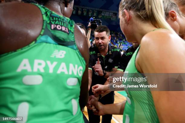 Dan Ryan head coach of the fever talks to the players after the win during the round 13 Super Netball match between West Coast Fever and Giants...