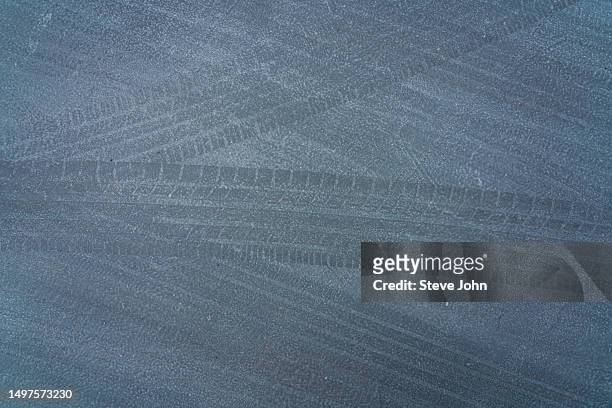 tire marks on road - skid marks stock pictures, royalty-free photos & images