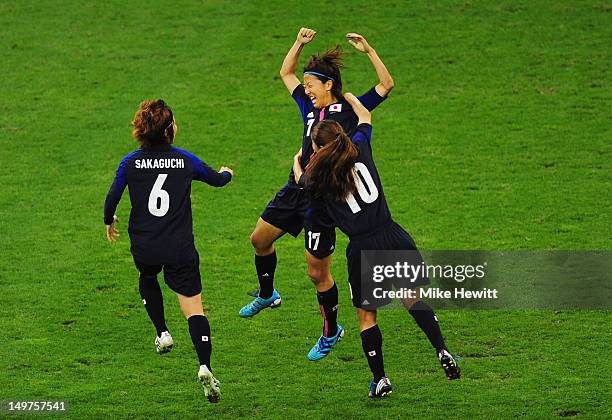 Yuki Ogimi of Japan celebrates with team mates Mizuho Sakaguchi and Homare Sawa of Japan after scoring the opening goal during the Women's Football...