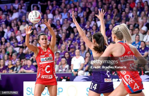 Maddy Proud of the Swifts passes the ball during the round 13 Super Netball match between Queensland Firebirds and NSW Swifts at Nissan Arena, on...