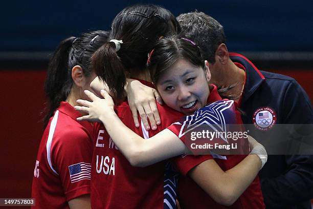 Ariel Hsing hugs Erica Wu of United States after Women's Team Table Tennis first round match against team of Japan on Day 7 of the London 2012...