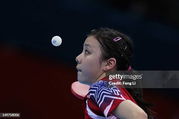 Ariel Hsing of United States competes during Women's Team Table Tennis first round match against team of Japan on Day 7 of the London 2012 Olympic...