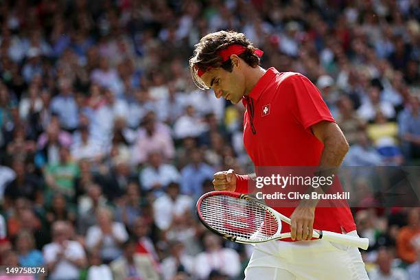 Roger Federer of Switzerland celebrates a point against Juan Martin Del Potro of Argentina in the Semifinal of Men's Singles Tennis on Day 7 of the...