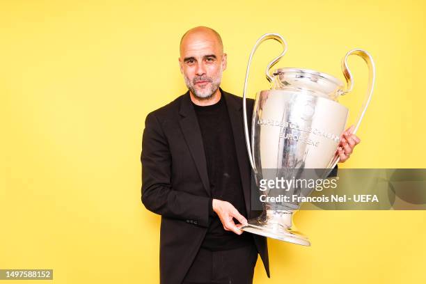Pep Guardiola, Manager of Manchester City, poses with the UEFA Champions League Trophy after the UEFA Champions League 2022/23 final match between FC...