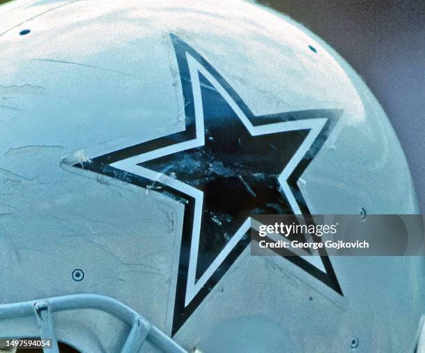 View of the star logo of the Dallas Cowboys appearing on the helmet of offensive lineman Tony Slaton during a game against the Washington Redskins at...