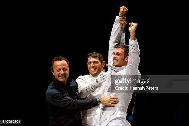 Aldo Montano and Luigi Samele of Italy reacts against after winning the bronze medal by defeating Russia during the Men's Sabre Team Fencing on Day 7...