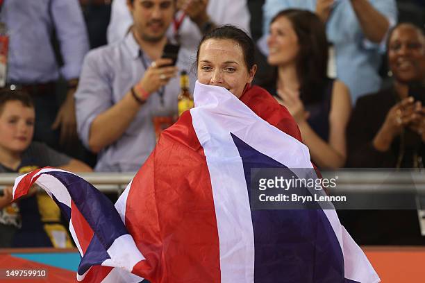 Victoria Pendleton of Great Britain celebrates with a Union Jack after winning gold in the Women's Keirin Track Cycling final on Day 7 of the London...