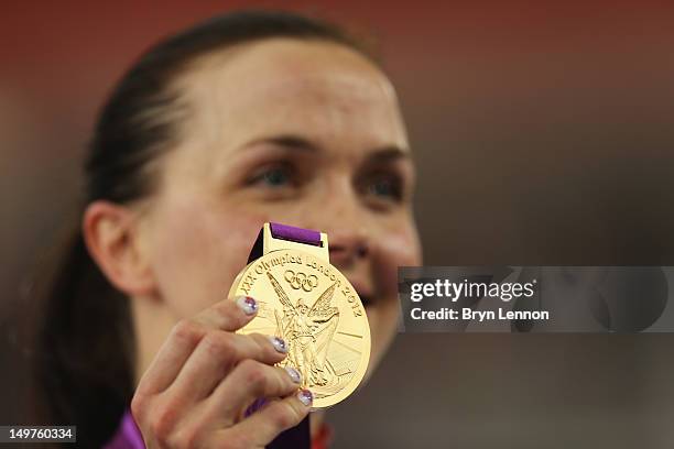 Victoria Pendleton of Great Britain celebrates with her gold medal during the medal ceremony for the Women's Keirin Track Cycling final on Day 7 of...